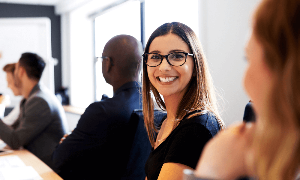 a young white woman with glasses smiling